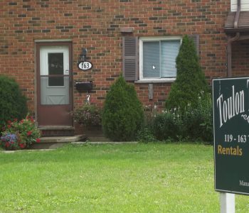Front of townhouse unit with sign
